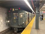 Holiday Arnine consist stopped at 57th St Station on the F Line